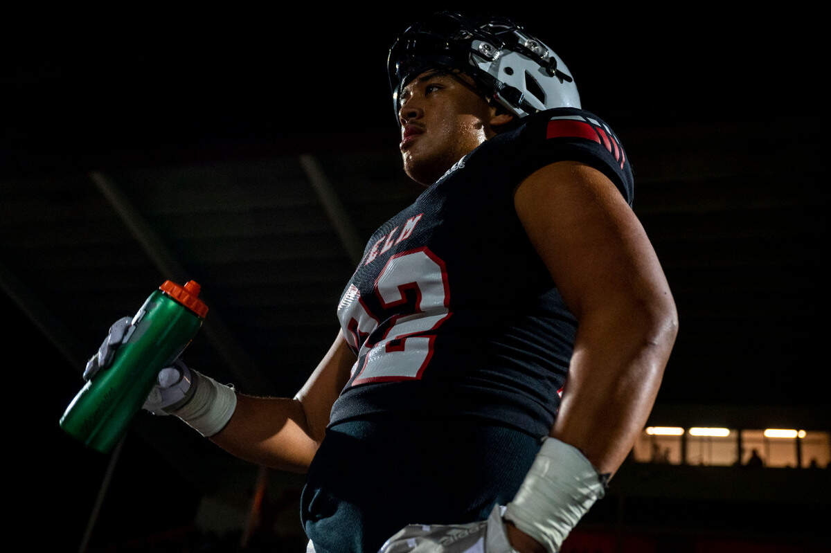 Yelm defensive end Kenji Scanlan takes a water break on the sideline during the second quarter of a 3A SSC game against Timberline on Thursday, Oct. 13, 2022, at Yelm High School in Yelm, Wash.