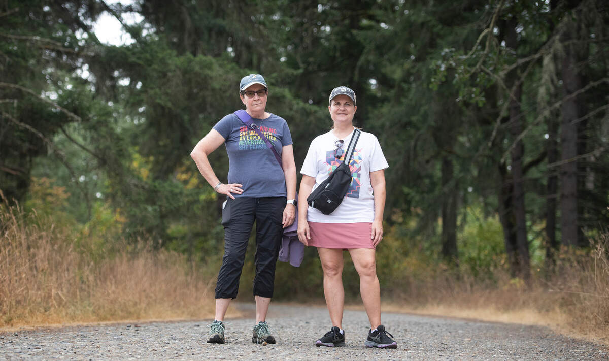 DuPont neighbors Judy Norris and Krista Novak worry the proposed expansion of Pioneer Aggregates Mine and the subsequent draining of the aquifer will forever destroy the natural beauty Sequalitchew Creek and the surrounding flora and fauna. The two are shown on the Sequalitchew Creek Trail in DuPont, Washington, on Thursday, Aug. 15, 2024.