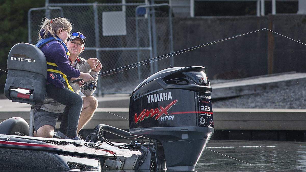 Tiger Free, of Chehalis, volunteered his boat and a little of his fishing expertise to disabled Navy veteran Dan Bannister, of Ellensberg, and his daughter Elizabeth 12 time during a Take a Warrior Fishing / C.A.S.T for Kids event Saturday 09/24/16 at American Lake Park by the VA Hospital in Lakewood. Local fishermen volunteers with 20 to 30 boats took Wounded Warriors out to fish on the lake while net pens with 250 Rainbow trout, brought in by the Wa. Department of Fish & Wildlife , provided angling opportunities for kids to fish from the beach at American Lake Park. The day ended at noon with a lunch provided by the Steilacoom Kiwanis Club. The City of Lakewood donated rods and reels for the event and members of the Department of Fish & Wildlife staffed the beach fishing area cleaning fish and untangling kids fishing gear to keep the little ones happy.