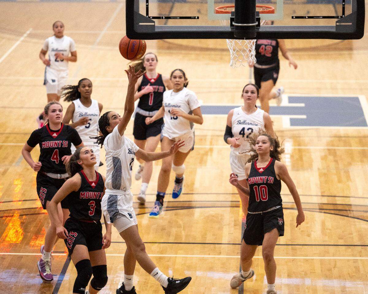 Bellarmine Prep guard Keiara Curtis (10) goes in for a layup on a fast break as Mount Si guard Grace Turley (3) defends during the third quarter of a Class 4A state regionals game on Saturday, Feb. 25, 2023, at Tacoma Community College, in Tacoma, Wash.