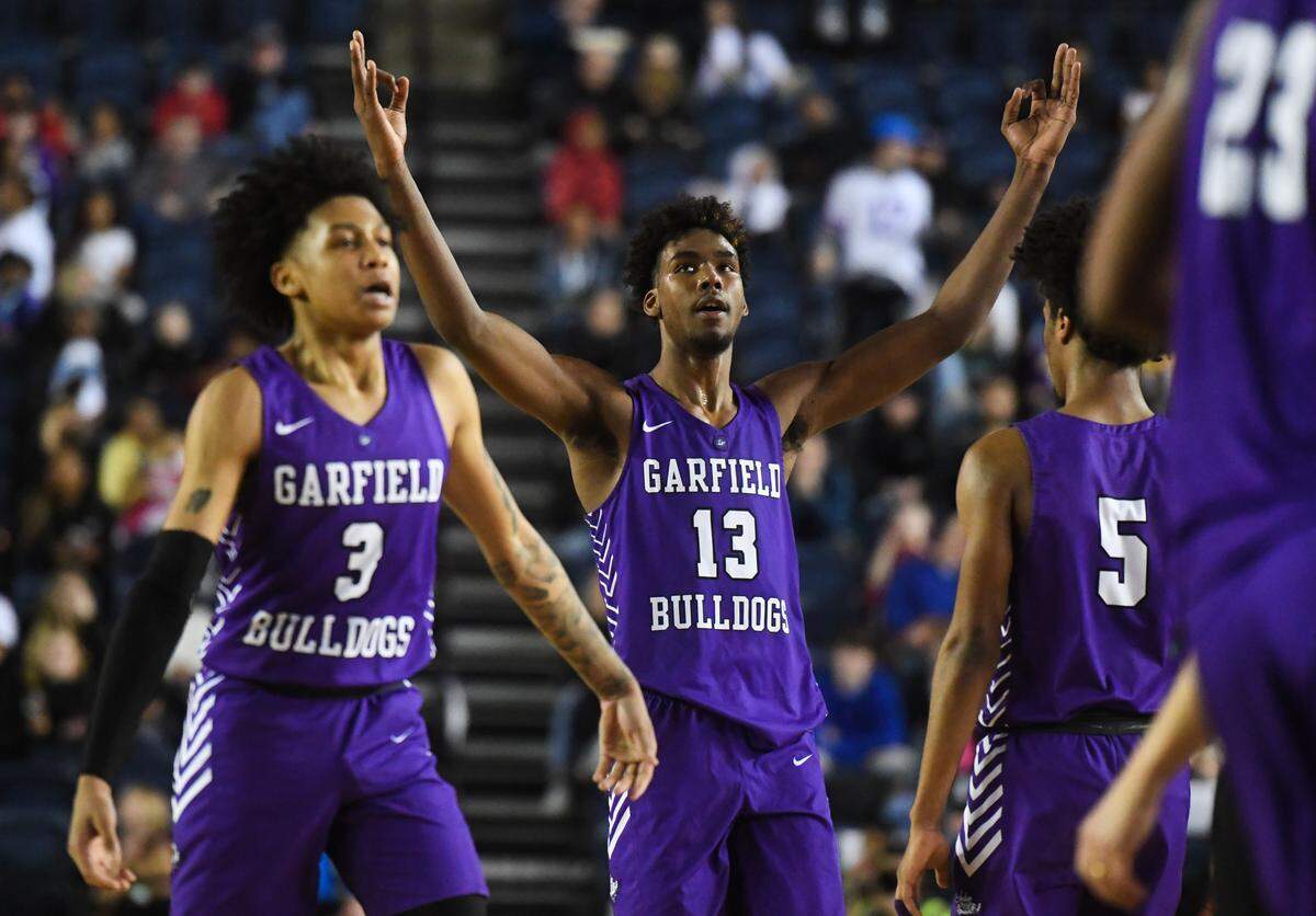 Garfield’s Tari Eason celebrates a three-point-shot during the fourth quarter. Garfield played O’Dea in the 3A boys championship game at the Hardwood Classic state basketball tournament at the Tacoma Dome in Tacoma, Wash., on Saturday, March 7, 2020.