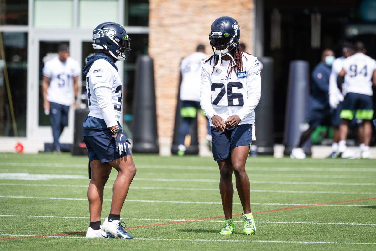 Seattle Seahawks defensive backs Quandre Diggs (37) and Shaquill Griffin (26) talk during training camp practice at the Virginia Mason Athletic Center in Renton, WA on August 12, 2020. (MANDATORY CREDIT Ñ ROD MAR/SEATTLE SEAHAWKS)