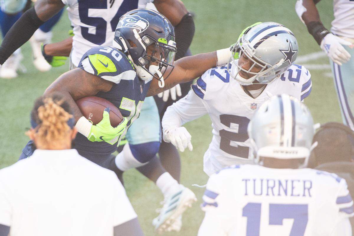 Seattle Seahawks running back Carlos Hyde (30) rushes during the third quarter. The Seattle Seahawks played the Dallas Cowboys in a NFL football game at CenturyLink Field in Seattle, Wash., on Sunday, Sept. 27, 2020.