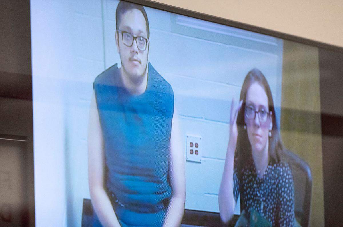 Samuel Bryon Kennedy, 23, left, appears in court virtually for his arraignment at the Pierce County Superior Courthouse in Tacoma, Wash. on Feb. 24, 2023. Kennedy was charged with second-degree murder in the death of his four-month-old son, who died at a hospital from traumatic injuries.