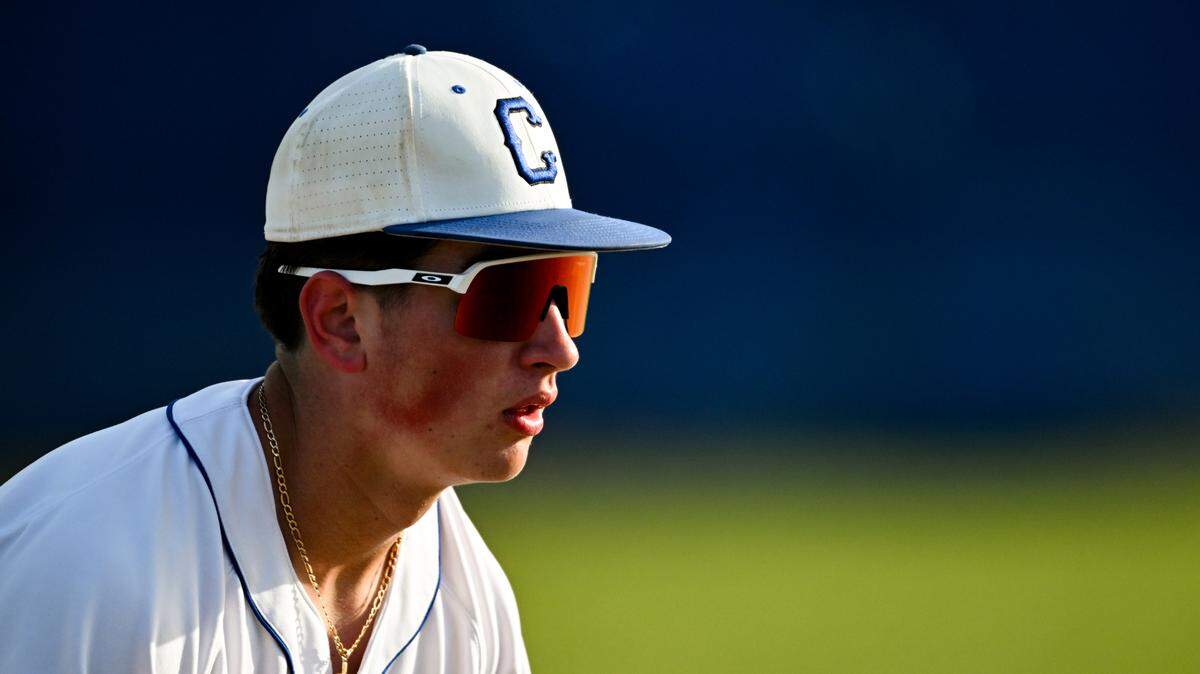 Curtis’s Harlan Carrillo (22) looks on from third base while Puyallup is at bat during the baseball game at Curtis Senior High School on April 15, 2025, in University Place.