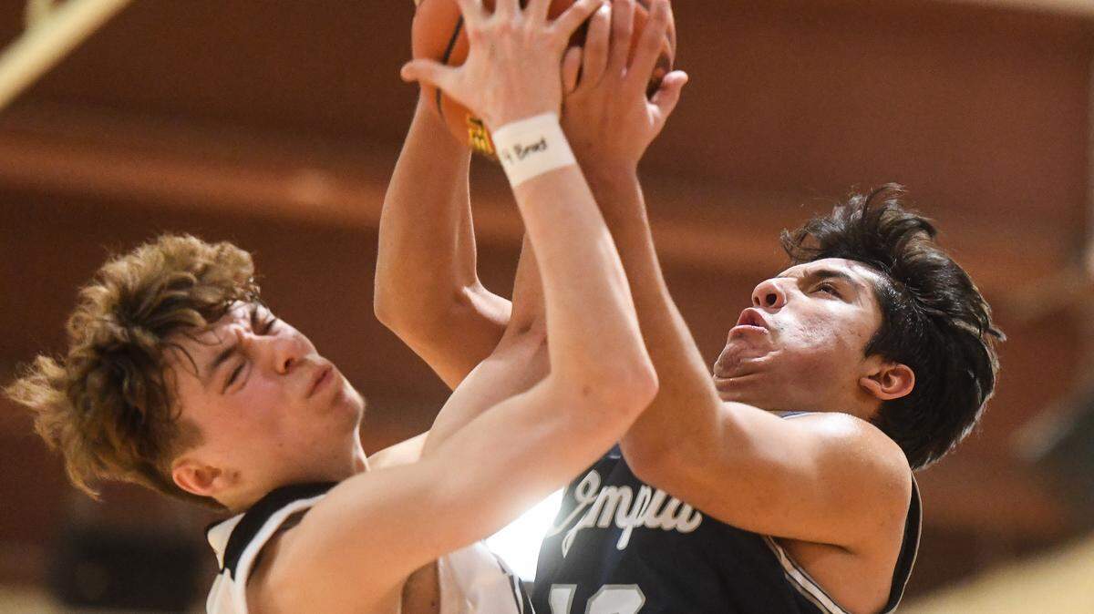Olympia’s Alfredo Ramirez-Cortes and Union’s Kaden Horn fight for a rebound during the fourth quarter. Olympia played Union in a basketball game at Wilson High School in Tacoma, Wash., on Friday, Feb. 14, 2020.