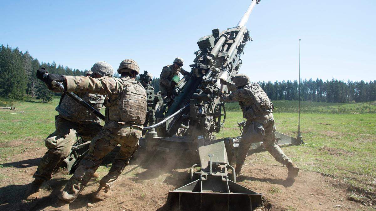 Soldiers with the 2-17 Field Artillery Battalion load the 155-mm Howitzer cannon during training exercises at Joint Base Lewis-McChord, Washington, on Tuesday, April 20, 2021.