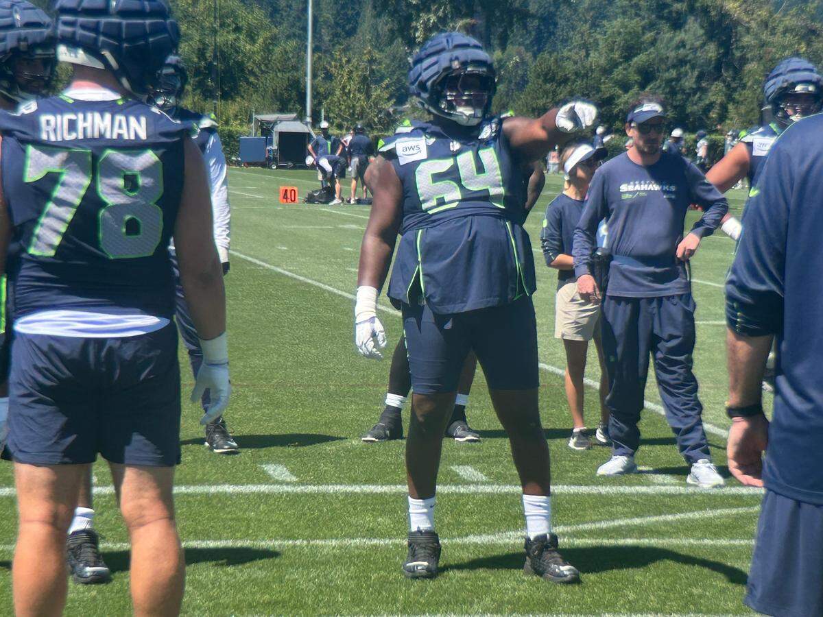 Seahawks right guard Charles Cross (64) points out his assigned area to block during a drill conducted by offensive line coach John Benton on the second day of Seattle’s NFL training camp Thursday, July 24, 2025, at the Virginia Mason Athletic Center in Renton.