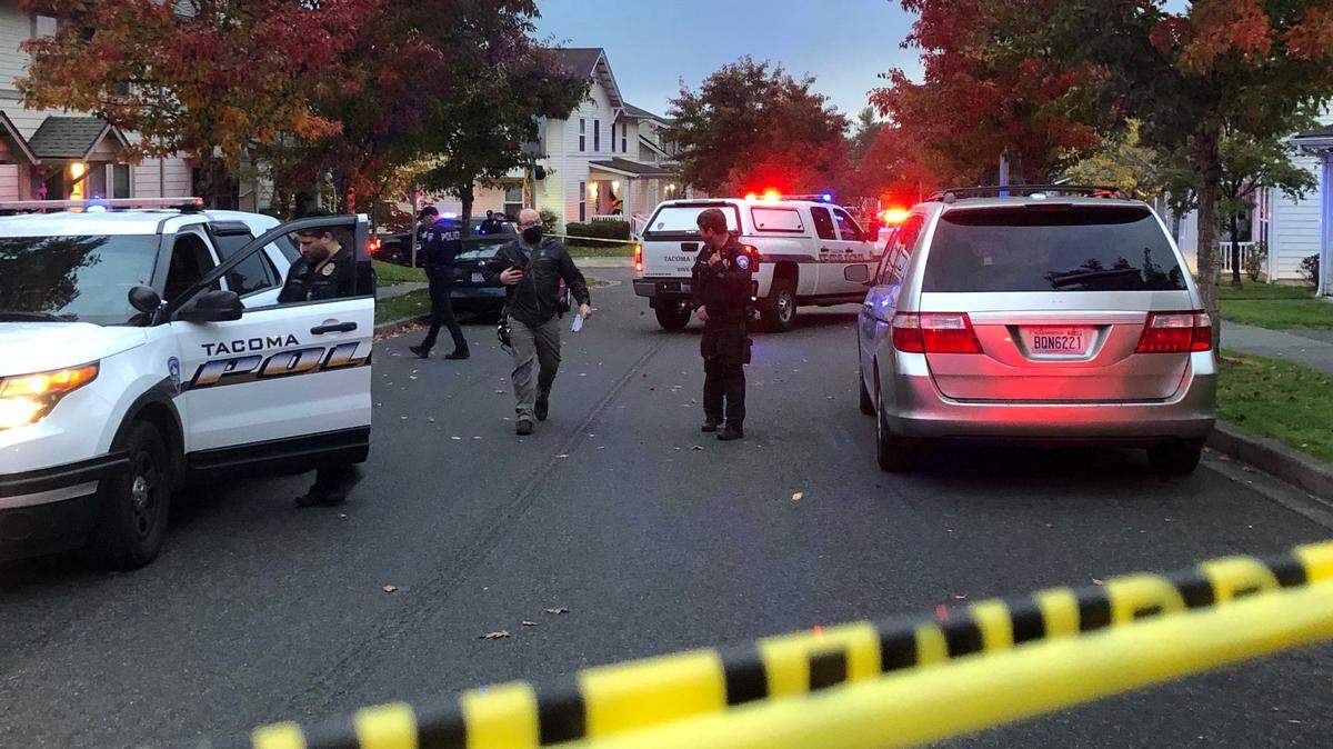 Tacoma police at the scene of a quadruple homicide in the city’s Salishan neighborhood in 2021.