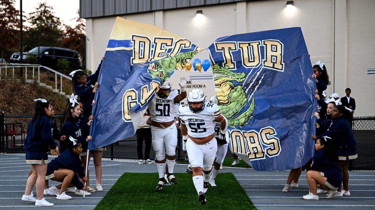 Decatur Golden Gators take to the field before the game against the Federal Way Eagles at Federal Way Memorial Stadium, Thursday, Oct. 26, 2023, in Federal Way, Wash.