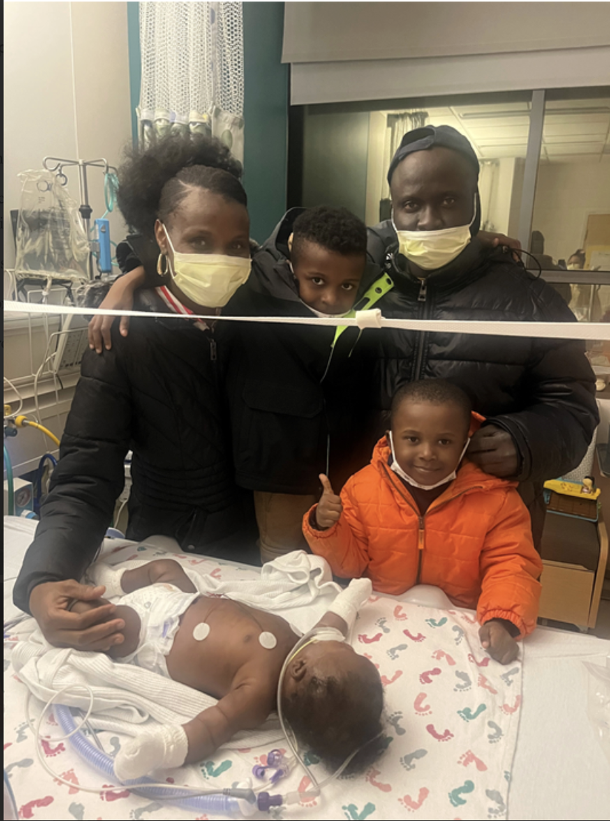 The Ntuadi family poses with their youngest son Hermann, who recently underwent open-heart surgery with no blood transfusions at Seattle Children’s Hospital.