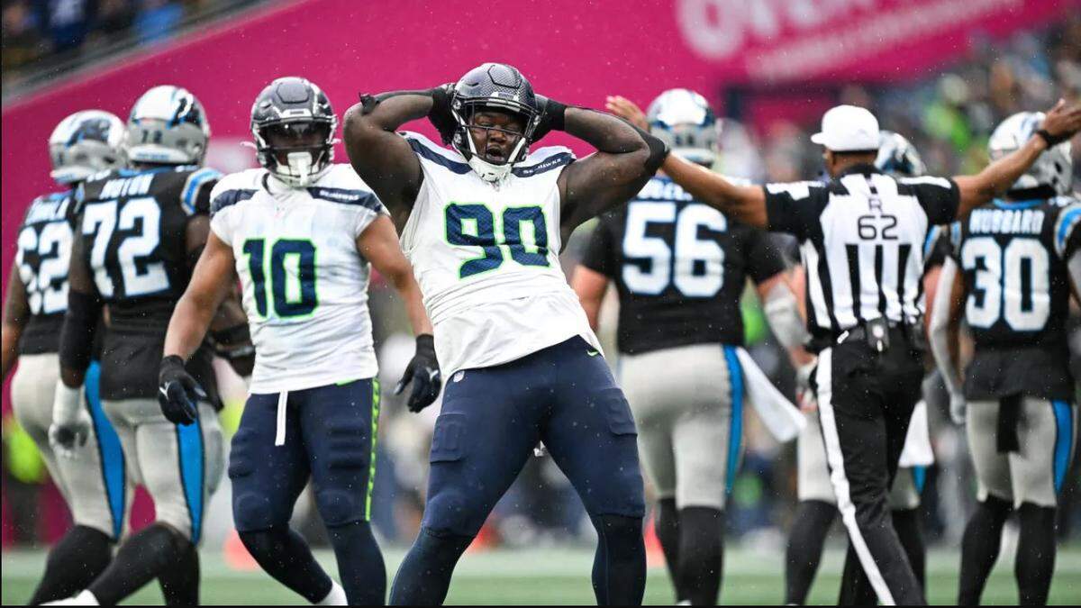 Jarran Reed (90) celebrates his sack of Carolina’s Andy Dalton with a Michael Bennett-like hip-thrust dance in the fourth quarter of the Seahawks’ 37-27 victory at Lumen Field Sept. 25, 2023.