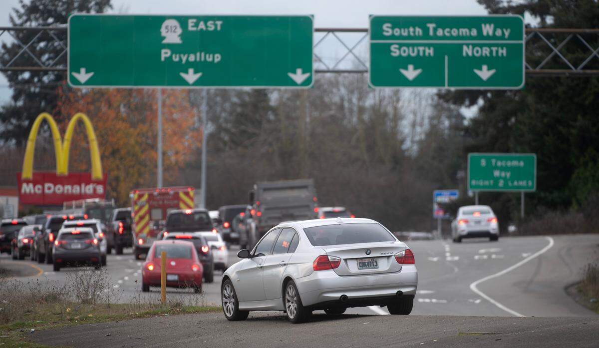 A car is left unattended along Interstate 5 in Lakewood, Washington, on Thursday, Dec. 19, 2024.