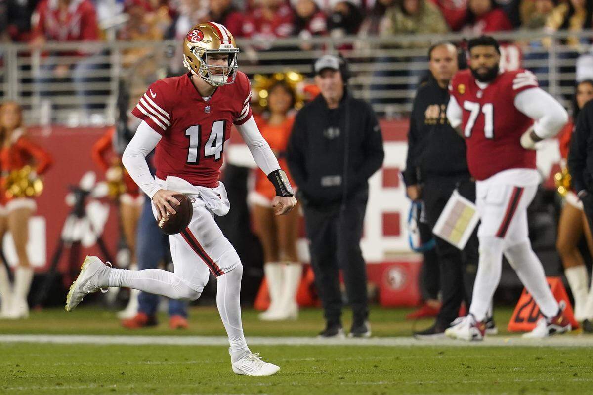 Dec 25, 2023; Santa Clara, California, USA; San Francisco 49ers quarterback Sam Darnold (14) runs the ball against the Baltimore Ravens in the fourth quarter at Levi's Stadium. Mandatory Credit: Cary Edmondson-USA TODAY Sports