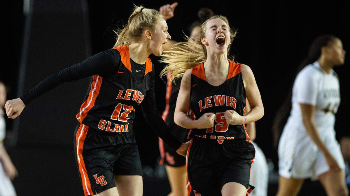 Lewis and Clark’s Kaylee Bishop (12) and Andie Zylack (15) celebrate after scoring in the third quarter. Kentridge played Lewis and Clark in a basketball game at the Hardwood Classic State Basketball Tournament at the Tacoma Dome in Tacoma, Wash., on Friday, March 1, 2019.