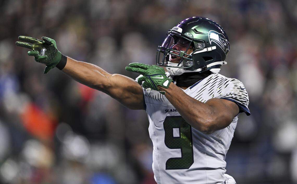 Seattle Seahawks running back Kenneth Walker III (9) reacts to 46-yard carry against the Los Angeles Rams during the first quarter of the game at Lumen Field, on Thursday, Dec. 18, 2025, in Seattle.