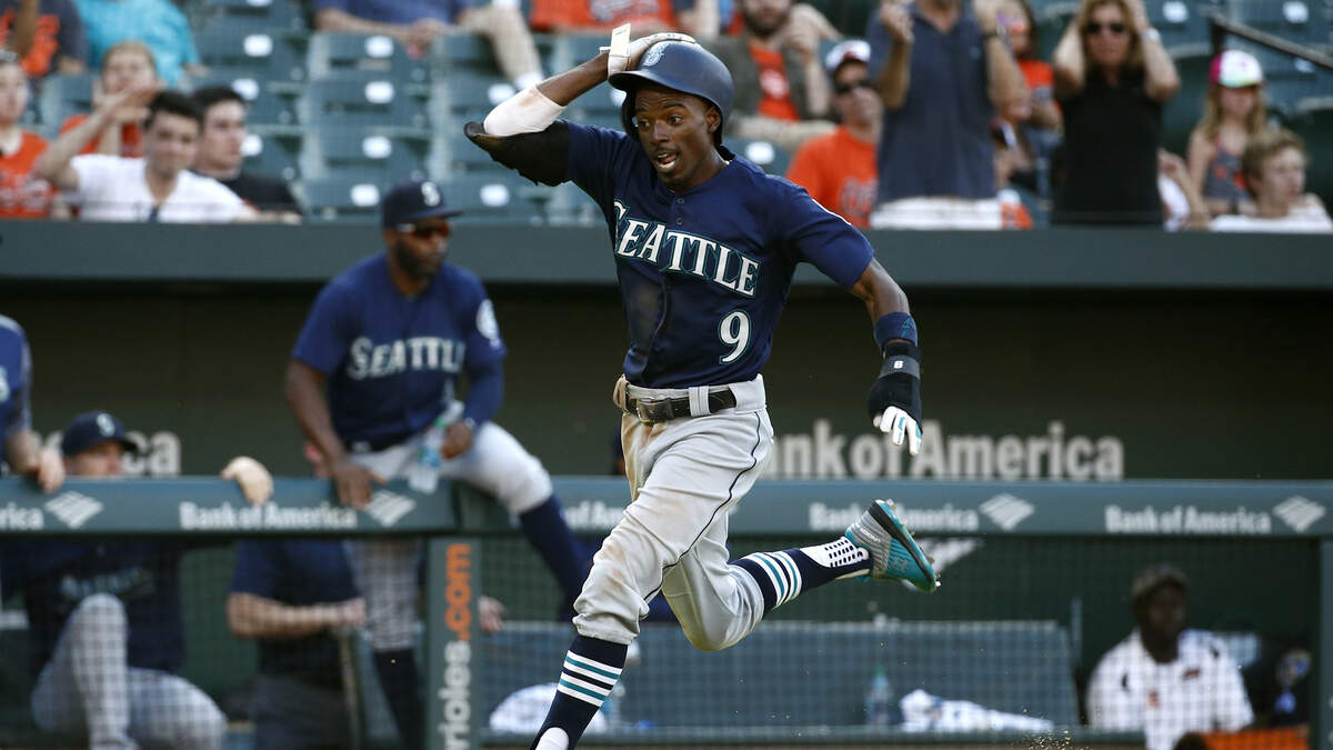 Seattle Mariners’ Dee Gordon scores a run on a single by Jean Segura in the 10th inning of a baseball game against the Baltimore Orioles, Thursday, June 28, 2018, in Baltimore. Seattle won 4-2 in 10 innings. (AP Photo/Patrick Semansky)