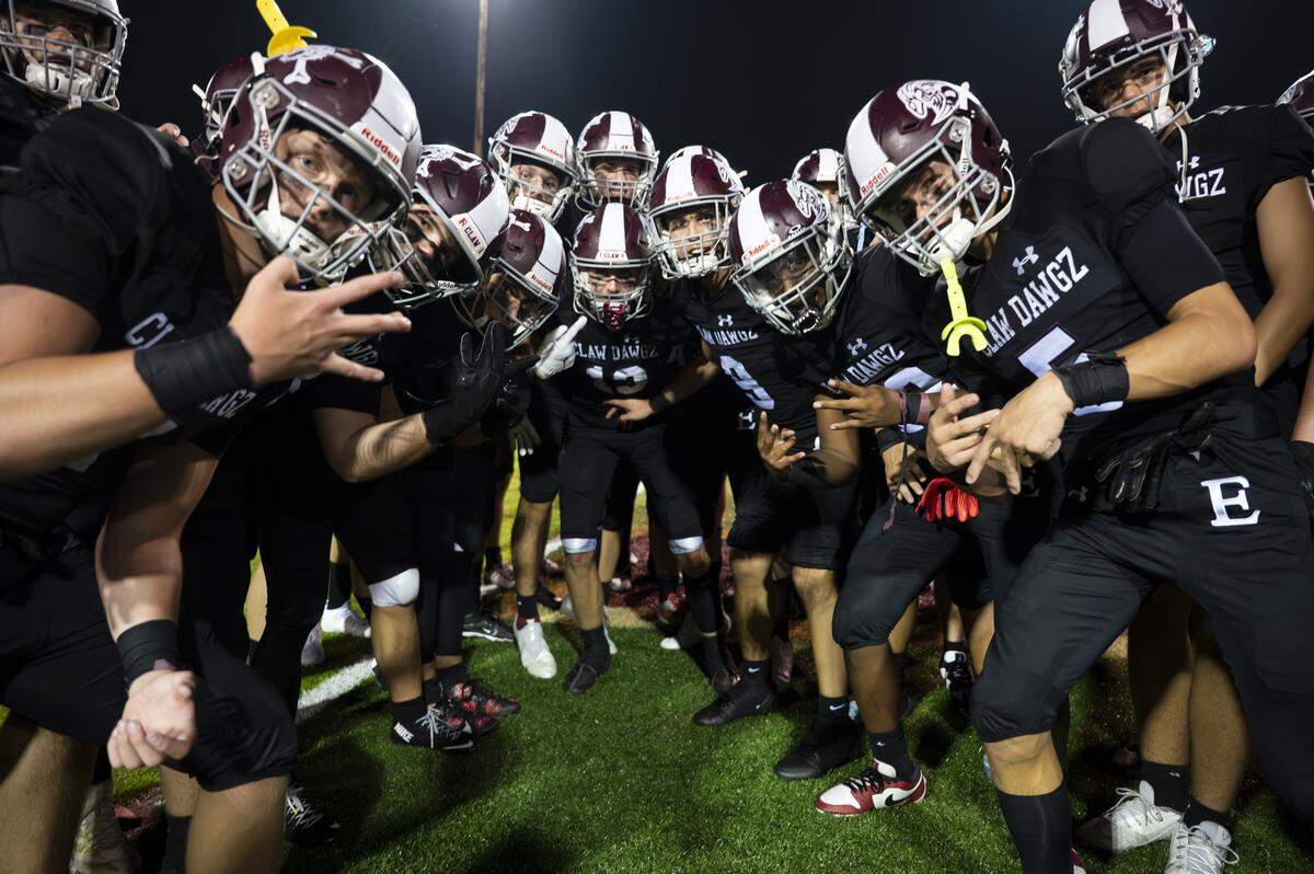Enumclaw Hornets celebrate their 30-14 victory against the Decatur Golden Gators during at Pete’s Pool, on Thursday, Sept. 4, 2025, in Enumclaw, Wash.