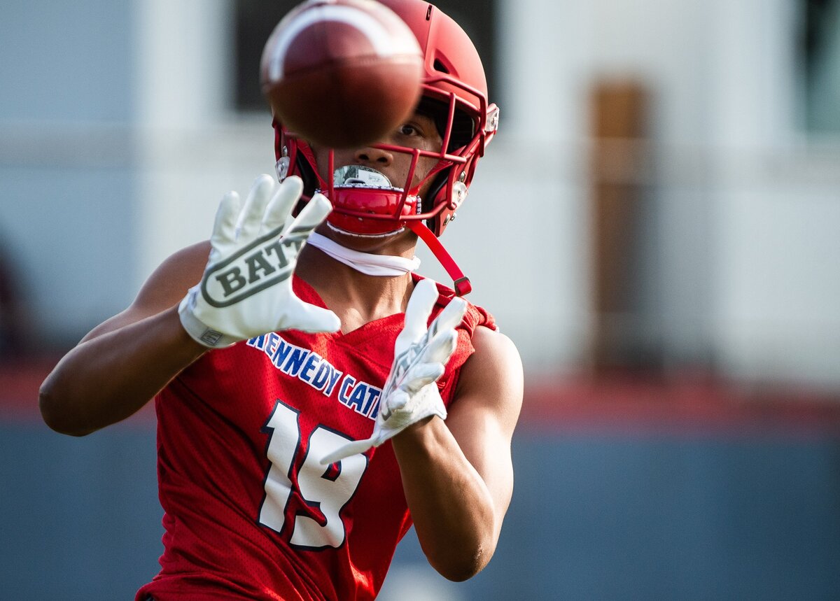 Wide receiver Jabez Tinae makes a catch during Kennedy Catholic High School football practice at Kennedy Catholic High School in Burien, Wash., on Thursday, Aug. 16, 2018. .
