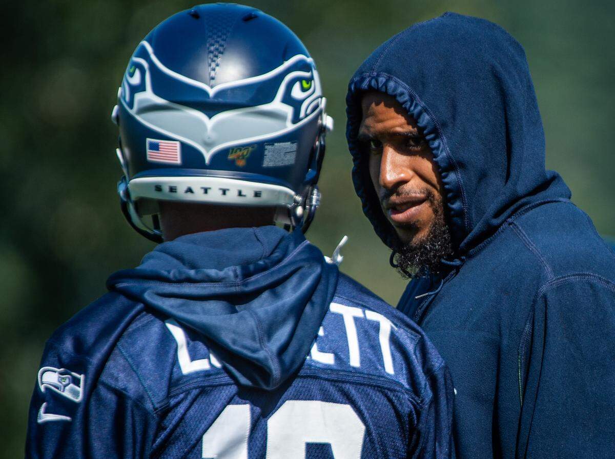 Bobby Wagner and Tyler Lockett chat during the Seattle Seahawks training camp at the Virginia Mason Athletic Center in Renton, Wash., on Thursday, July 25, 2019.