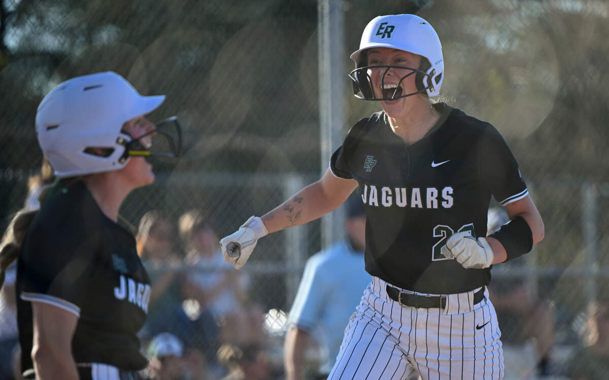 Emerald Ridge’s Abygale Redwine (22) and Emerald Ridge’s Ava Puttler (14) react to scoring two runs against Puyallup in the eighth inning of the softball game at Puyallup High School, on Friday, April 18, 2025, in Puyallup, Wash.
