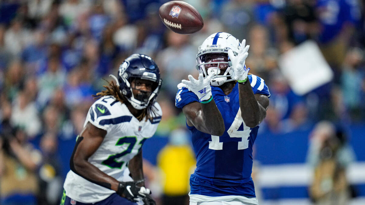 Indianapolis Colts wide receiver Zach Pascal (14) makes catch for a touchdown in front of Seattle Seahawks cornerback Tre Flowers (21) during the second half of an NFL football game in Indianapolis, Sunday, Sept. 12, 2021. (AP Photo/AJ Mast)