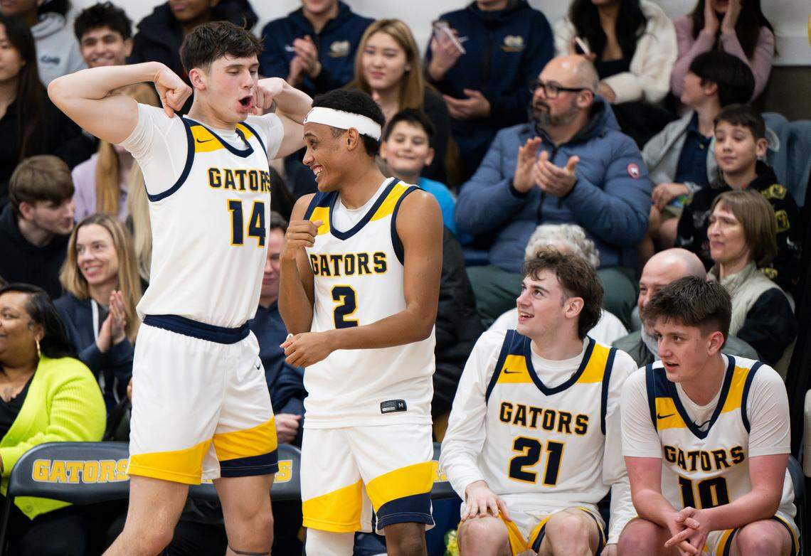 Annie Wright Gators bench reacts to a three-point basket during the second half of the boy’s basketball game against Life Christian at Annie Wright School, on Thursday, Jan. 23, 2025, in Tacoma Wash.