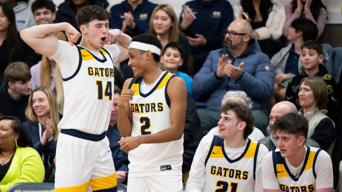 Annie Wright Gators bench reacts to a three-point basket during the second half of the boy’s basketball game against Life Christian at Annie Wright School, on Thursday, Jan. 23, 2025, in Tacoma Wash.