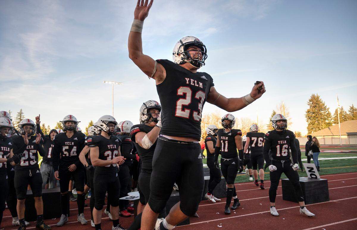 Yelm junior running back Brayden Platt celebrates with teammates following the Tornados’ 36-27 victory over the Kennewick Lions in Saturday afternoon’s 3A football state quarterfinal game at Yelm High School in Yelm, Washington, Nov. 19, 2022.