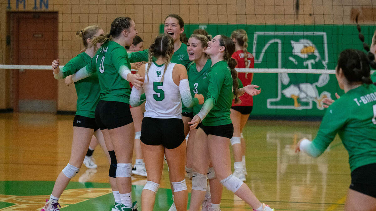 Tumwater celebrates after the final point of its three-set win over R.A. Long in a winner-to-State match at the 2A District 4 Tournament on Nov. 4.