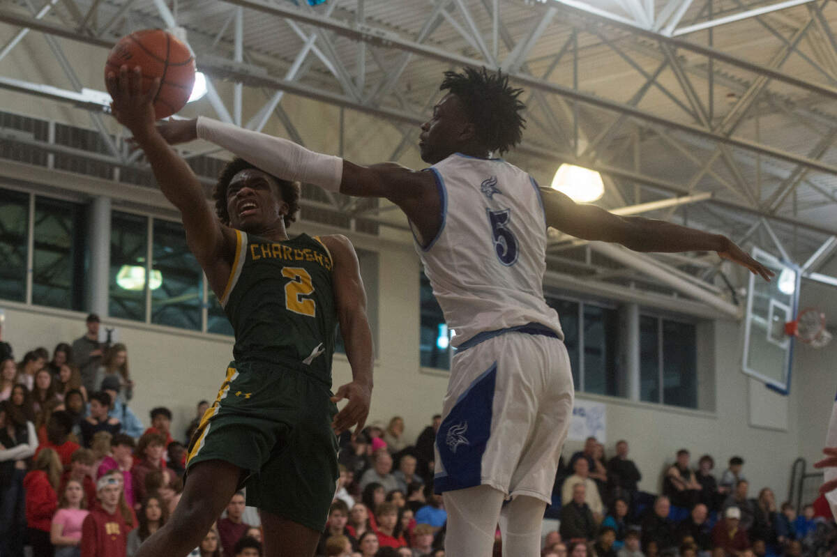 Kentridge guard Jalon Blackwell (2) puts up a shot while Curtis guard Zoom Diallo (5) defends during a Class 4A West Central/Southwest district basketball game on Saturday, Feb. 11, 2023 at Curtis High School in University Place, Wash.
