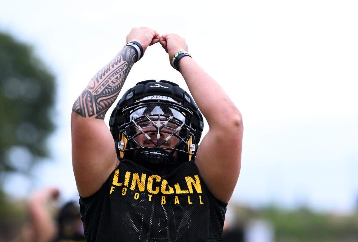 Lincoln defensive lineman Anthony Mancao runs drills during a football practice at Lincoln high School, on Wednesday, Aug. 21, 2024, in Tacoma, Wash.