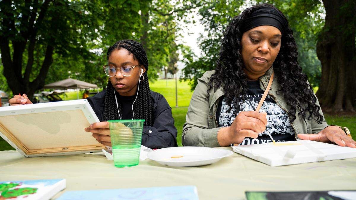 Latisha Conley and her daughter, Larrisa Conley, paint at the third annual Juneteenth celebration at Wright Park in Tacoma, Wash. on Saturday, June 18, 2022.