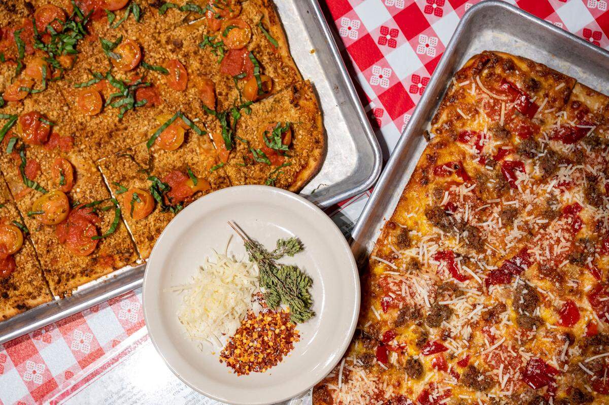 The Quickie, a vegan pie, and The Haven (right) are two of the four thin-crust bar pizzas at E9 Firehouse, best enjoyed with an E9 beer in the other hand.
