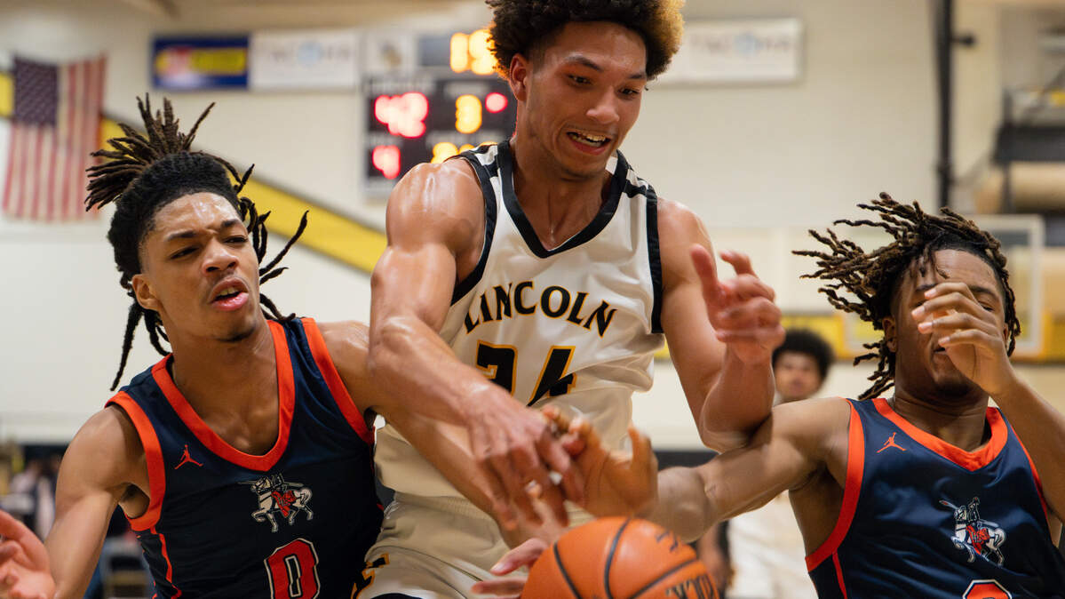 Lincoln’s Omarion Boston (24) goes for an offensive rebound against Lakes during the boys basketball game at Lincoln High School, on Wednesday, Jan. 31, 2024, in Tacoma, Washington.