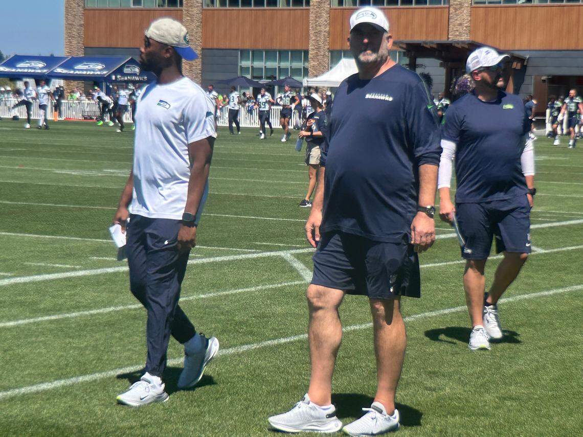 New Seahawks offensive line coach John Benton (middle), a veteran of 19 NFL seasons coaching the same, outside-zone blocking scheme, at the second practice of Seattle’s NFL training camp Thursday, July 24, 2025, at the Virginia Mason Athletic Center in Renton.