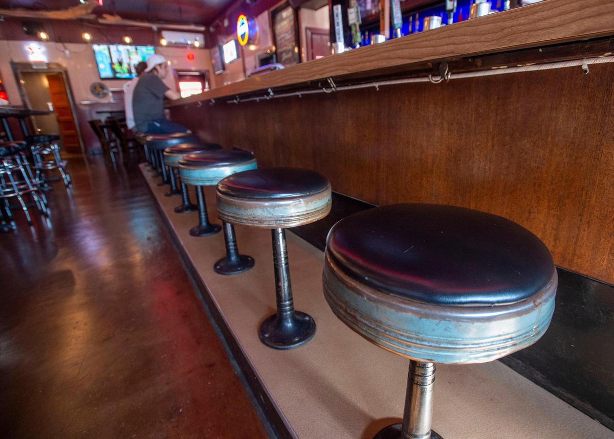 They needed a deep cleaning but the Ashleys kept the original black leather bar stools. Photo taken in Tacoma on Wednesday, Sept. 1, 2021.