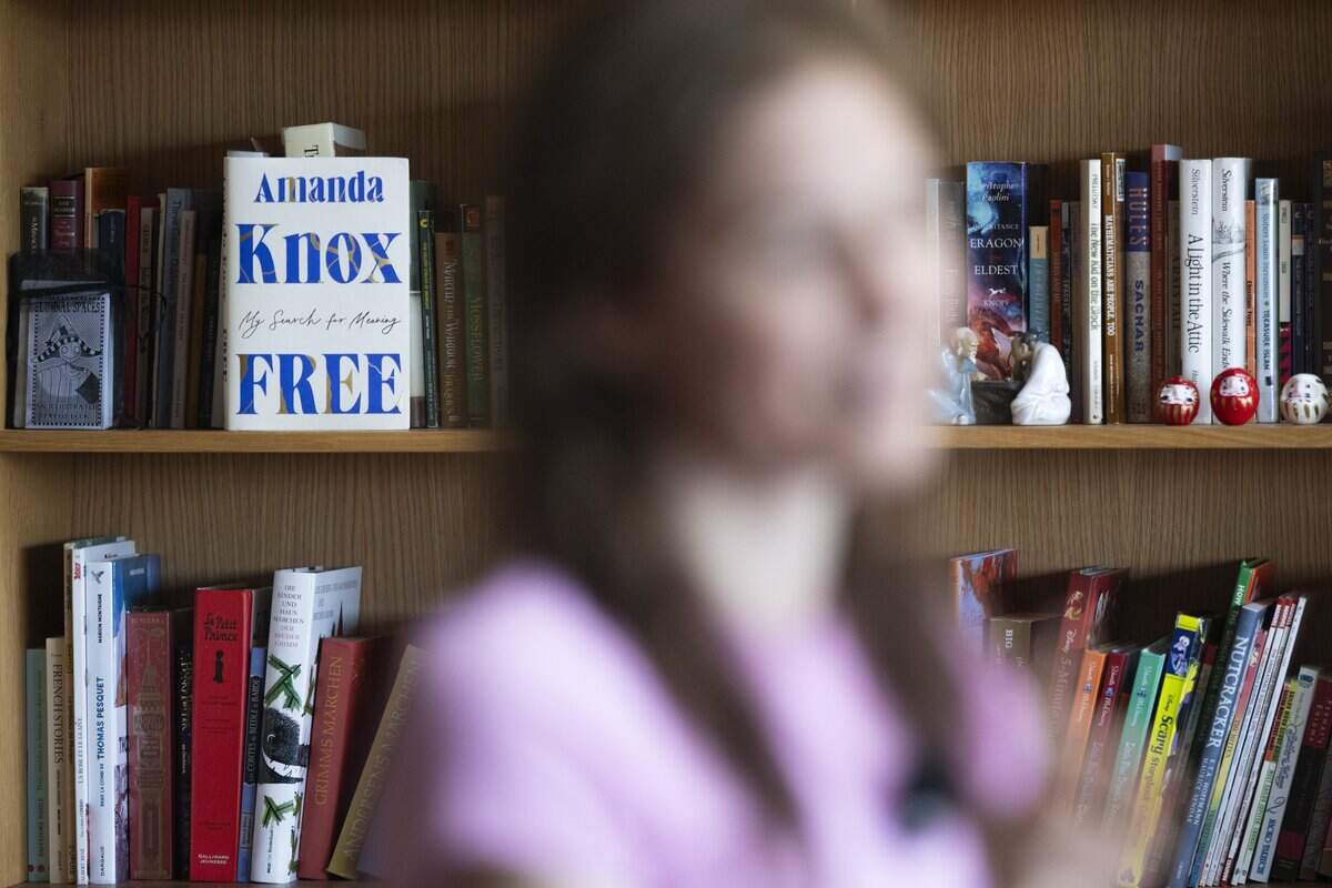 A copy of “Free: My Search for Meaning,” a memoir by Amanda Knox, sits on a shelf in Knox's home as she speaks with The News Tribune about her upcoming one-woman show, “Cartwheel,” on Tuesday, July 7, 2026, in Vashon, Wash.