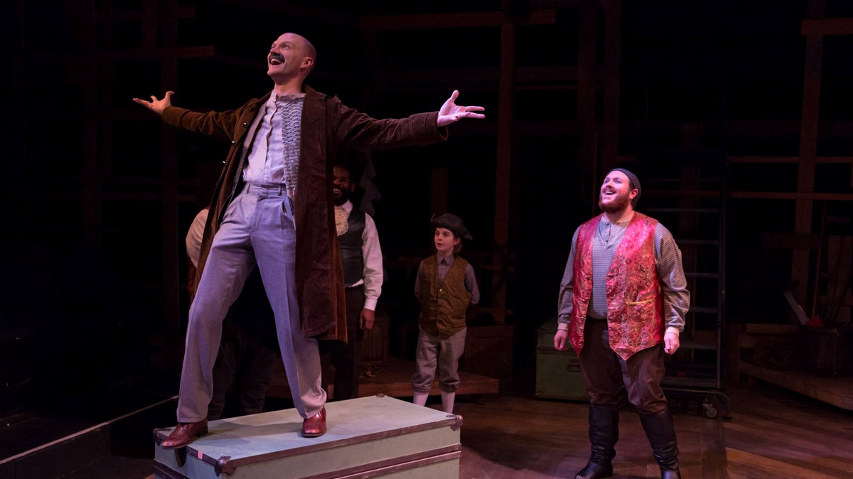 Kyle Sinclair, left, as Black Stache, with Chap Wolff as Smee and the ensemble cast from the Lakewood Playhouse production of "Peter and the Starcatcher. "