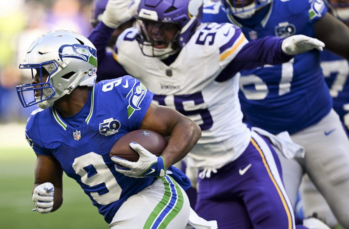 Seattle Seahawks running back Kenneth Walker III (9) carries the ball during the first quarter of the game against the Minnesota Vikings at Lumen Field, on Sunday, Nov. 30, 2025, in Seattle.