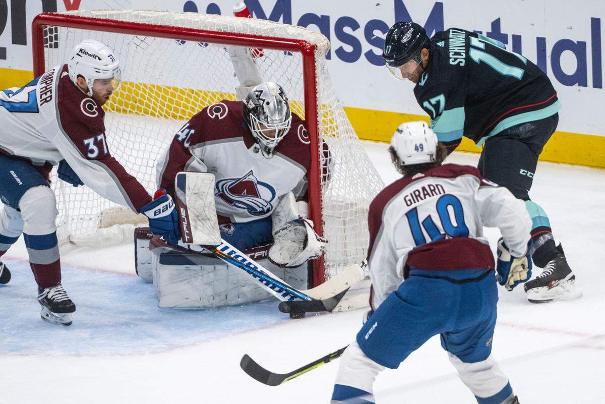 Seattle Kraken center Jaden Schwartz (17) tries to hit the puck into the goal as Colorado Avalanche goaltender Alexandar Georgiev (40) tries to block him during the first period of a first round 2023 Stanley Cup Playoffs game at Climate Pledge Arena in Seattle on Monday, April 24, 2023.