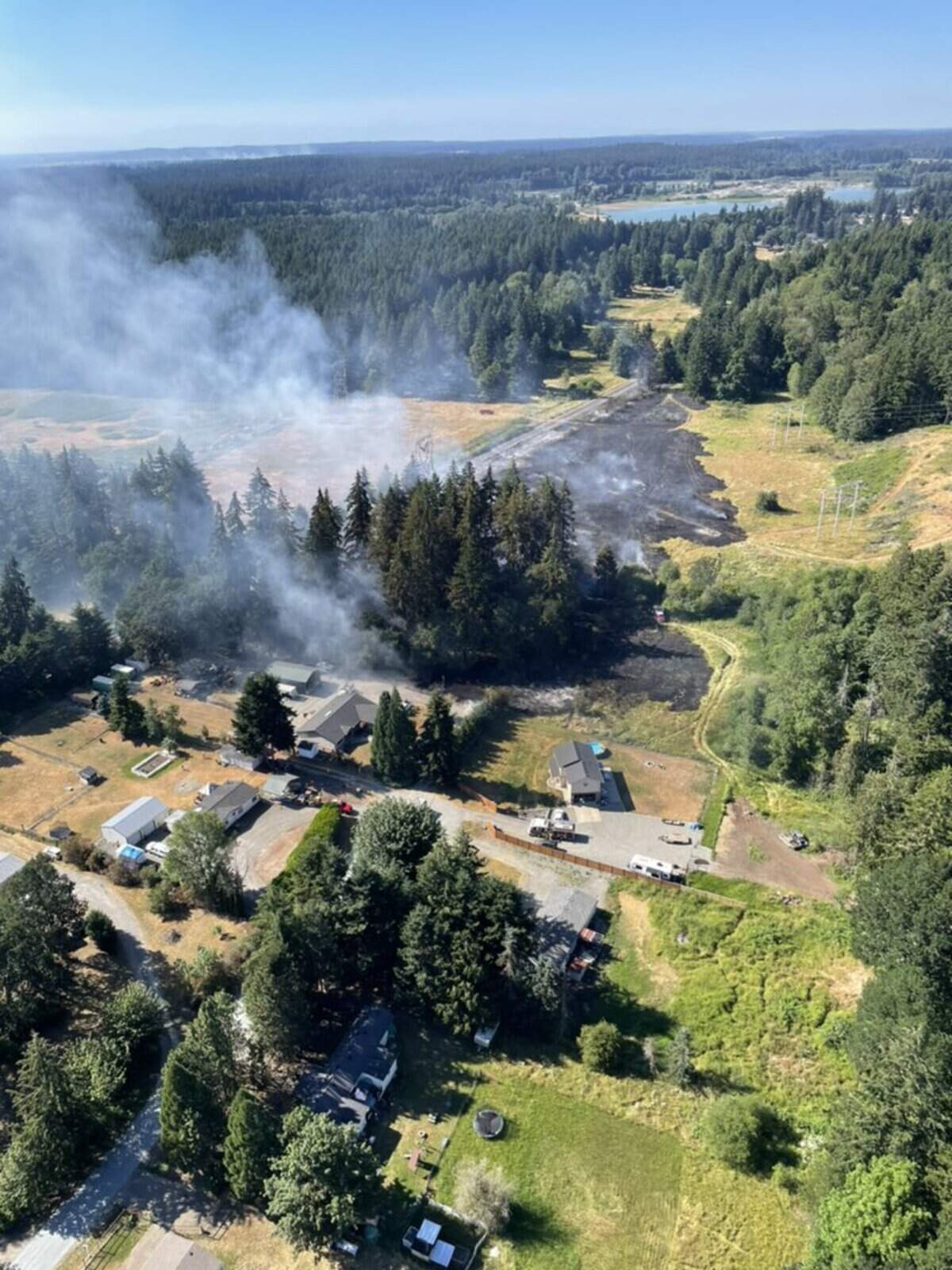 Crews responded to a large brush fire July 9, 2024 on state Route 507 south of Roy.