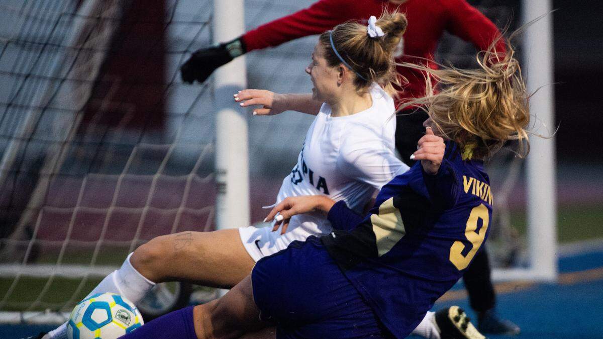 PuyallupÕs Sydney Evans’ shot is blacked by OlympiaÕs Landry McCann during the second half. Puyallup played Olympia in a soccer match at Memorial Stadium in Federal Way, Wash., on Saturday, Nov. 9, 2019.