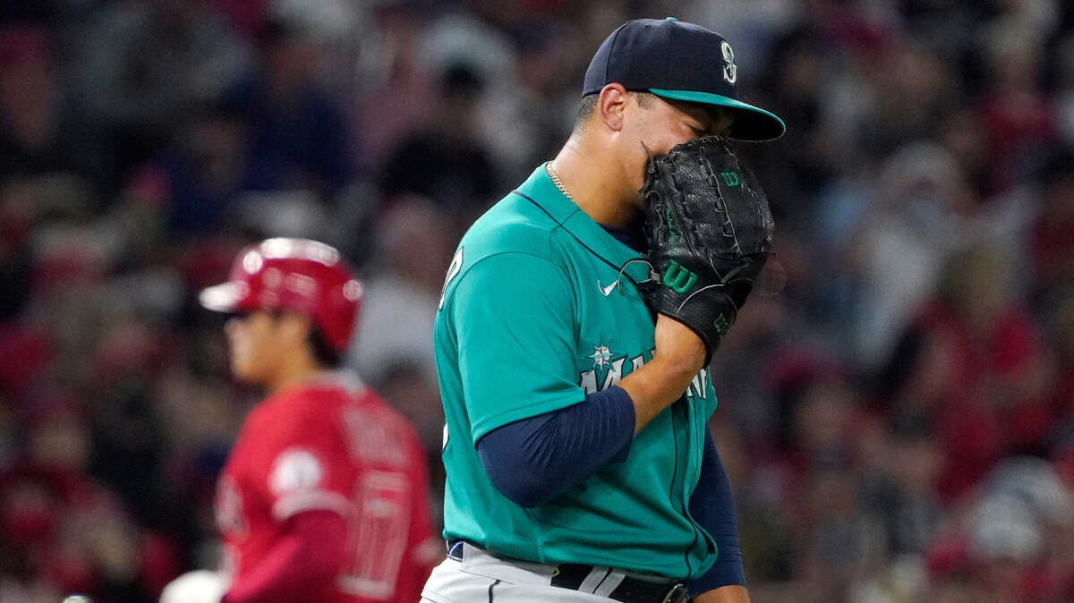 Seattle Mariners relief pitcher Justus Sheffield, right, yells into his glove after walking in a run as Los Angeles Angels designated hitter Shohei Ohtani advances to third during the fifth inning of a baseball game Saturday, Sept. 25, 2021, in Anaheim, Calif. (AP Photo/Mark J. Terrill)