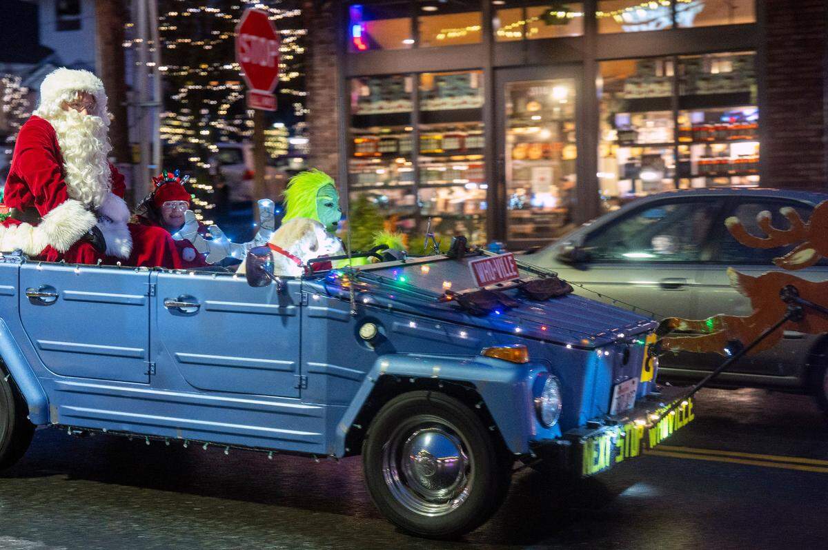 The Grinch drives down Harborview Drive during the annual Gig Harbor Lighted Car Parade.