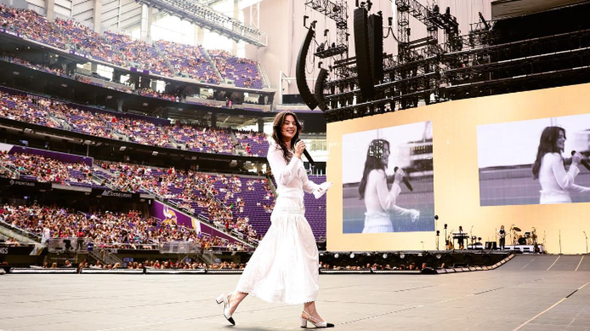 Singer-songwriter Gracie Abrams crosses the stage while opening for Taylor Swift in Minneapolis.