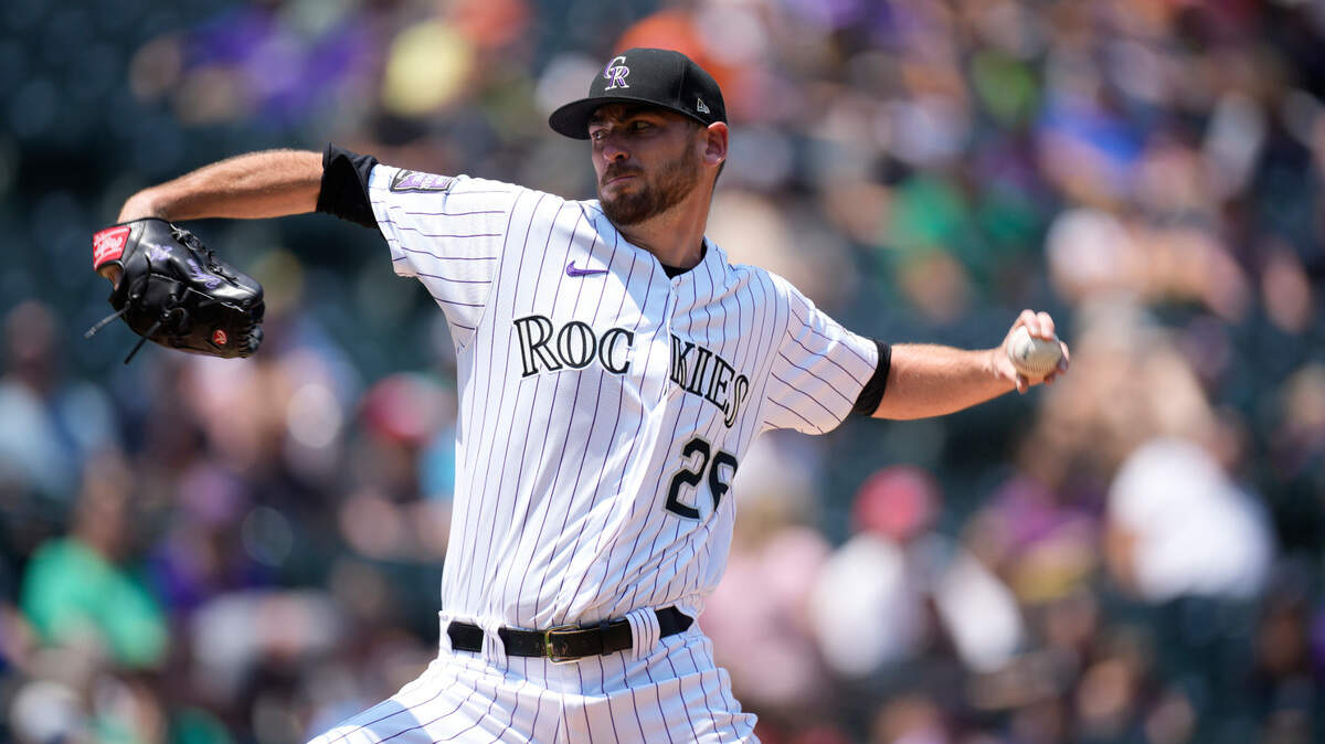 Colorado Rockies starting pitcher Austin Gomber works against the Seattle Mariners in the first inning of a baseball game Wednesday, July 21, 2021, in Denver. (AP Photo/David Zalubowski)