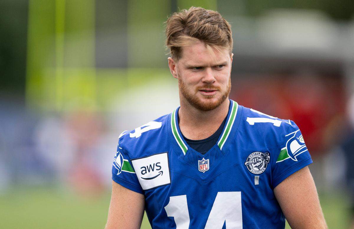 Seattle Seahawks quarterback Sam Darnold (14) warms up during training camp at Virginia Mason Athletic Center on Friday, July 25, 2025, in Renton.