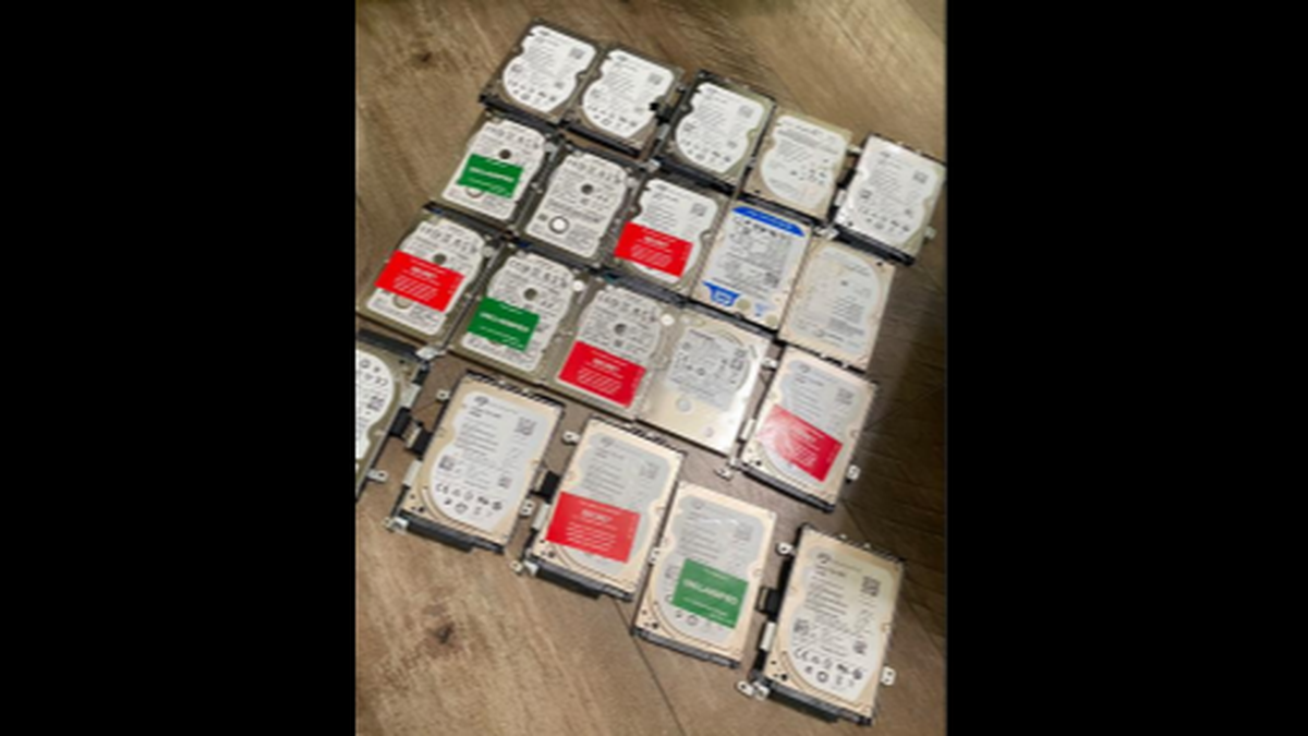 Sgt. Jian Zhao allegedly sent this photo of 20 classified hard drives, some labeled in red “SECRET” to an individual in China while negotiating their sale on July 16, 2024. 