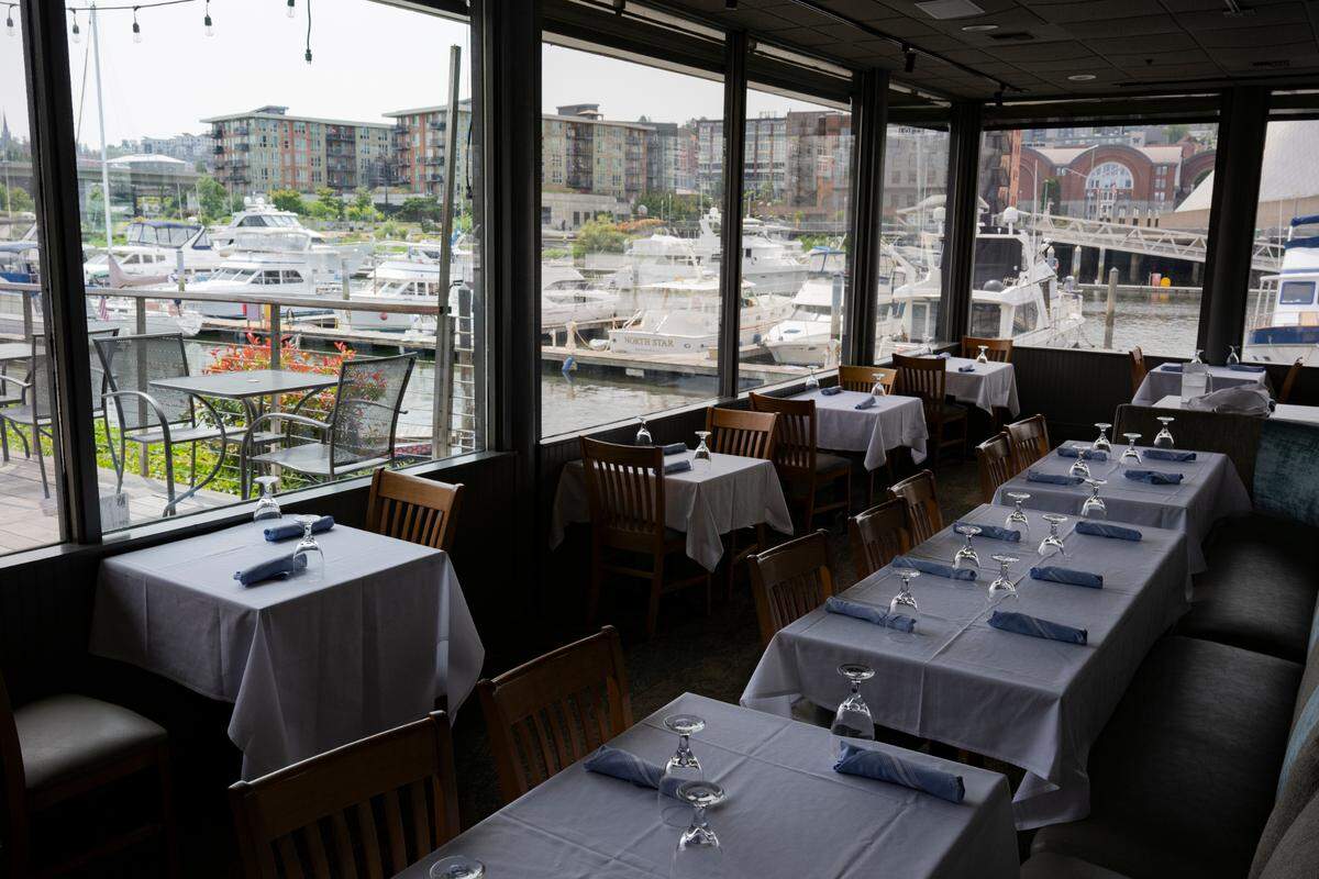 The dining room and deck at Johnny’s Dock remains, even if the restaurant has closed again. The property owner hopes to find a new tenant while continuing to pursue a property sale for redevelopment.